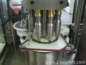 Used Borgo 8 head rotary capper model V8-T with centrifugal bowl and cap elevator