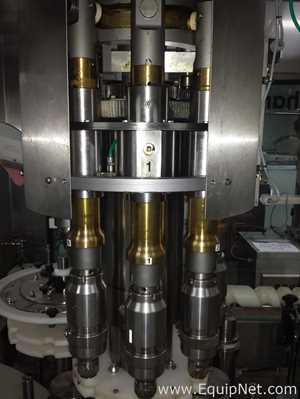 Used Borgo 8 head rotary capper model V8-T with centrifugal bowl and cap elevator