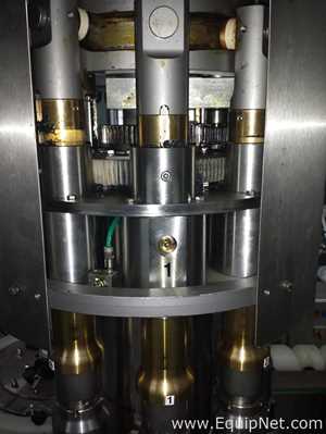 Used Borgo 8 head rotary capper model V8-T with centrifugal bowl and cap elevator