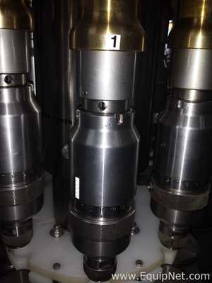 Used Borgo 8 head rotary capper model V8-T with centrifugal bowl and cap elevator