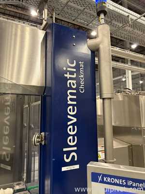 Krones Sleevematic Can Labeler with Checkmat Label Inspection and Shrinkmat Steam Tunnel