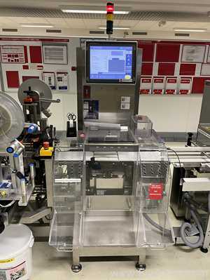 OCS Checkweighers GmbH HC Check Weigher and Reject Station - Syrup Line 4 Packaging