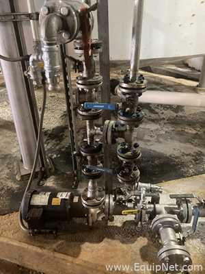 Approximately 6000 gallon Plastic Tank With Stainless Steel Pump  P-4785