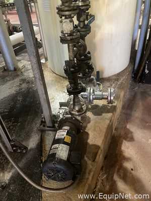 Approximately 6000 gallon Plastic Tank With Stainless Steel Pump  P-4785