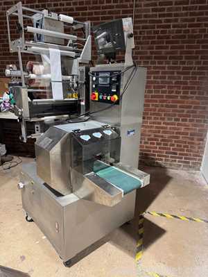 Embaladora de Fluxo PAC Machinery Group FW400HMI