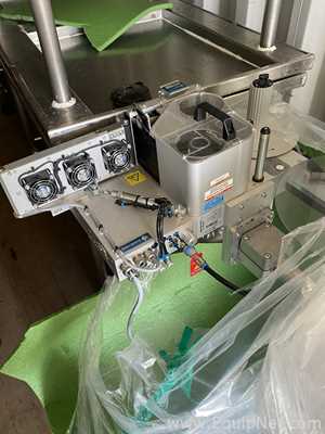 Domino M230i-WR100-90-110x300-LEFT Print and Apply Labeler