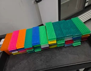 Lot of Assorted Laboratory Tube Racks and Plastic Beakers