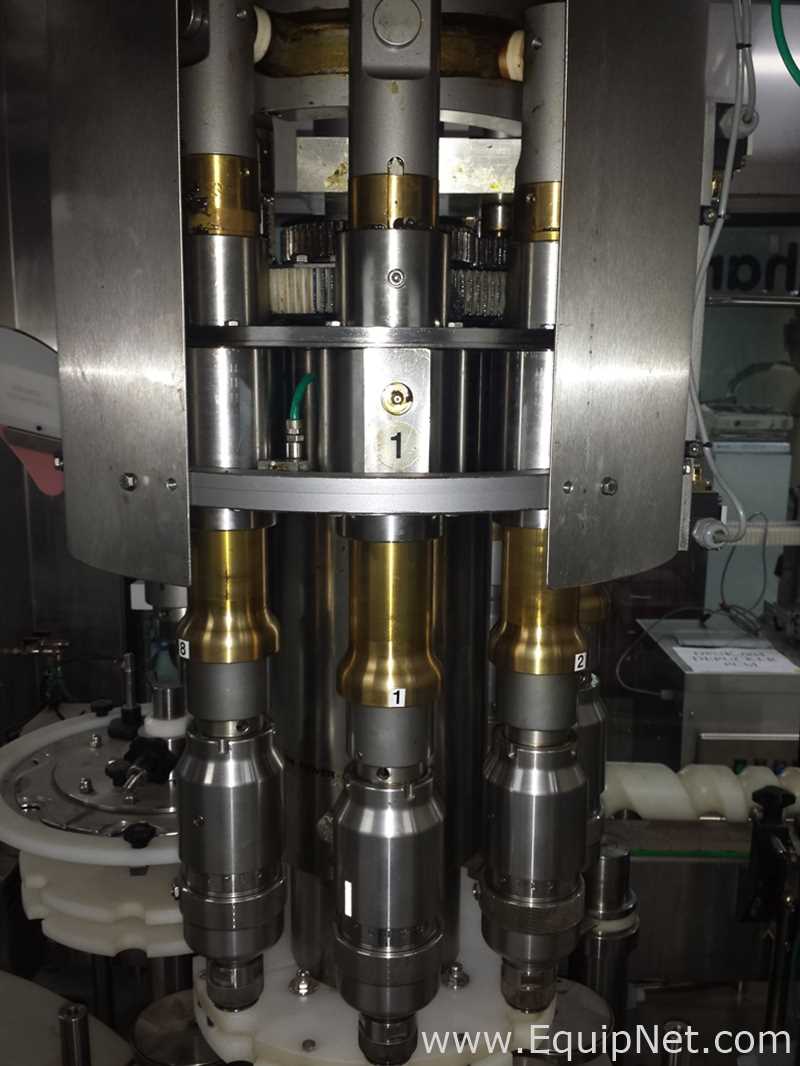 Used Borgo 8 head rotary capper model V8-T with centrifugal bowl and cap elevator