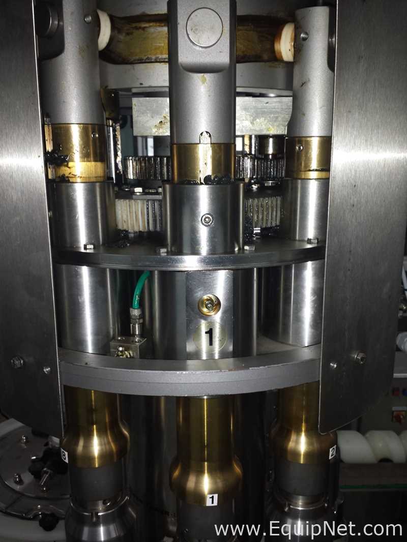 Used Borgo 8 head rotary capper model V8-T with centrifugal bowl and cap elevator