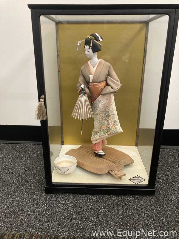 Doll Enclosed in Glass Case