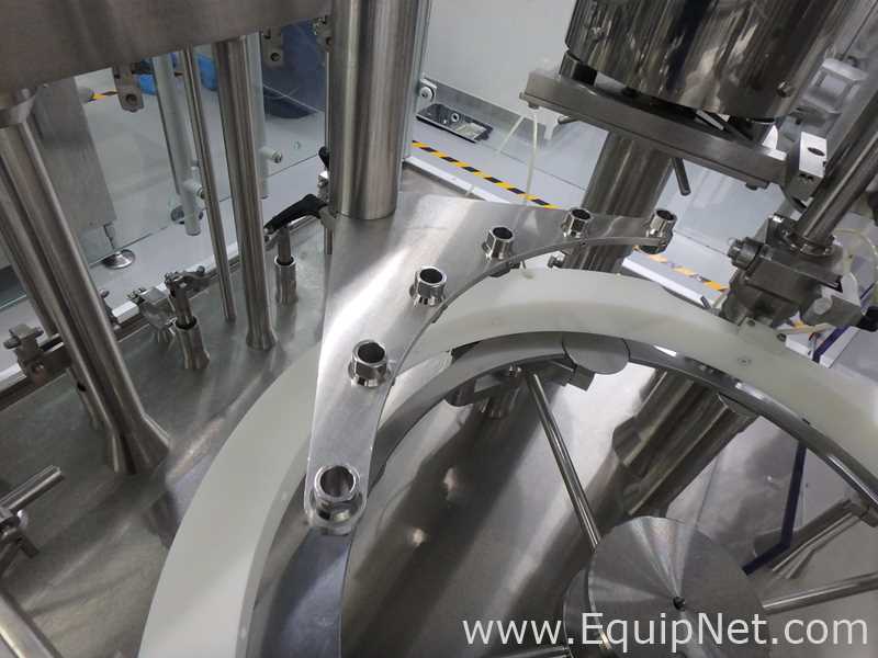 Maquina Monobloque de Llenado-Tapado de Frasco marcaRomacoMacofar modeloLVI4 con Equipos Perifericos
