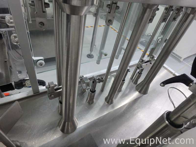 Maquina Monobloque de Llenado-Tapado de Frasco marcaRomacoMacofar modeloLVI4 con Equipos Perifericos