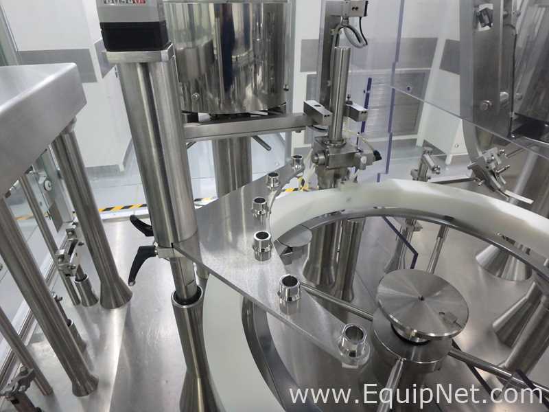 Maquina Monobloque de Llenado-Tapado de Frasco marcaRomacoMacofar modeloLVI4 con Equipos Perifericos