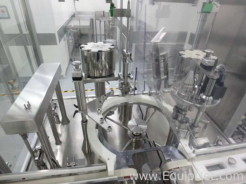 Maquina Monobloque de Llenado-Tapado de Frasco marcaRomacoMacofar modeloLVI4 con Equipos Perifericos