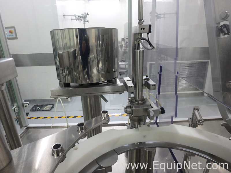 Maquina Monobloque de Llenado-Tapado de Frasco marcaRomacoMacofar modeloLVI4 con Equipos Perifericos