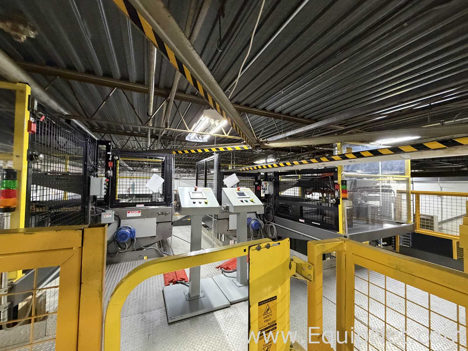 Dual Columbia HL 2000 Palletizers with Wulftec Pallet Wrapper and Ryson Spiral Case Conveyor